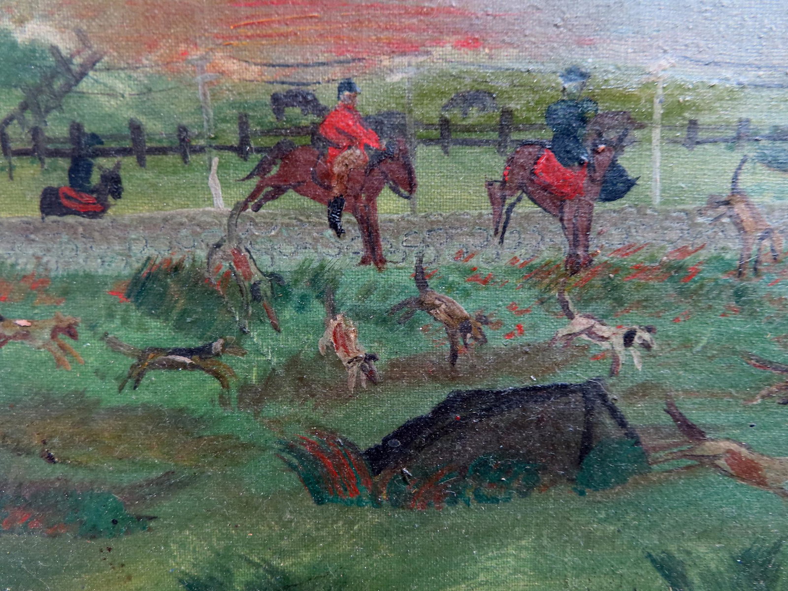 Primitive O/C Horse hunt depicting riders on horseback: Primitive O/C Horse hunt depicting riders on horseback with hounds leaping stone wall chasing fox. Several minor punctures in canvas, otherwise good condition. Mid to late 19th century. Measures XXX.