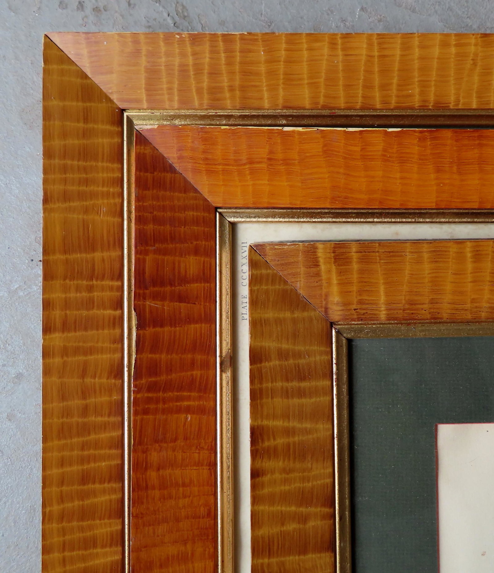 A grouping of 6 grain painted frames, probably mid 20th: A grouping of 6 grain painted frames that simulates tiger maple,20th century, one missing part of the gold inset, others with minor use wear and overall very good condition. The largest frame measures