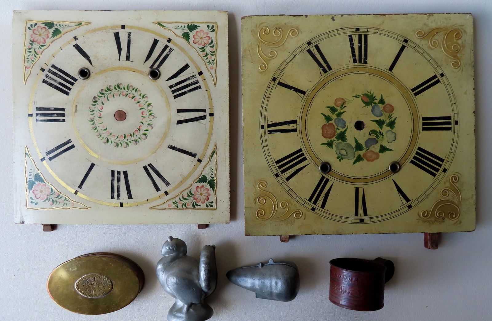 Grouping of 6 country decorative objects: Grouping of 6 country decorative objects including: Two hand painted wooden clock faces, early to mid 19th century - 11 1/4" x 11 7/8 (signed illegibly in pencil on reverse and also dated Feb 28 1830)