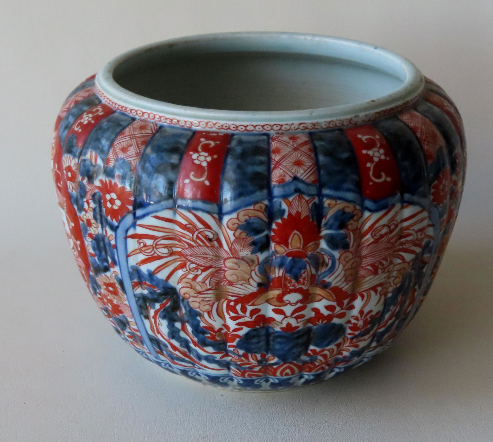 An Imari vase with ribbed sides and with hand painted (1 of 6)
