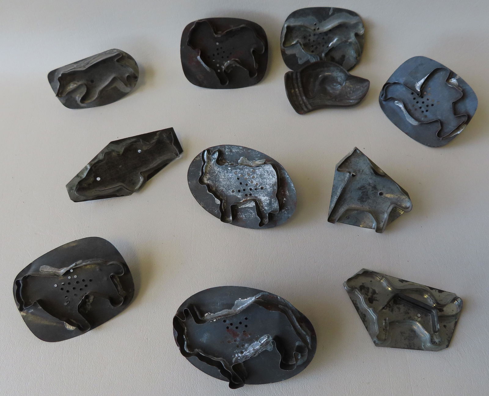 Grouping of 11 early tin figural cookie cutters, 19th (1 of 2)