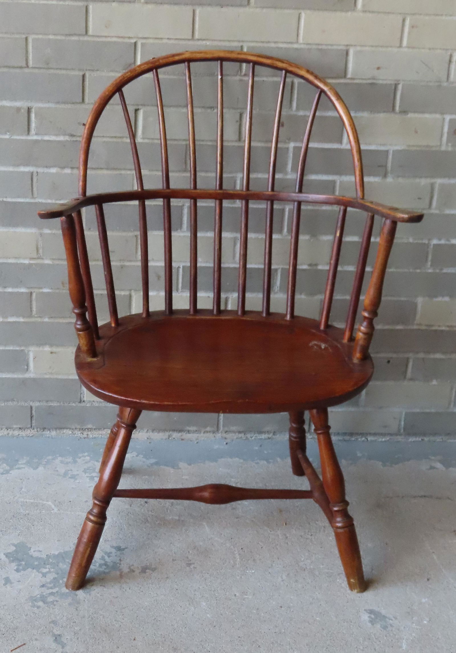 A sack-back Windsor chair with saddle seat, splayed (1 of 6)