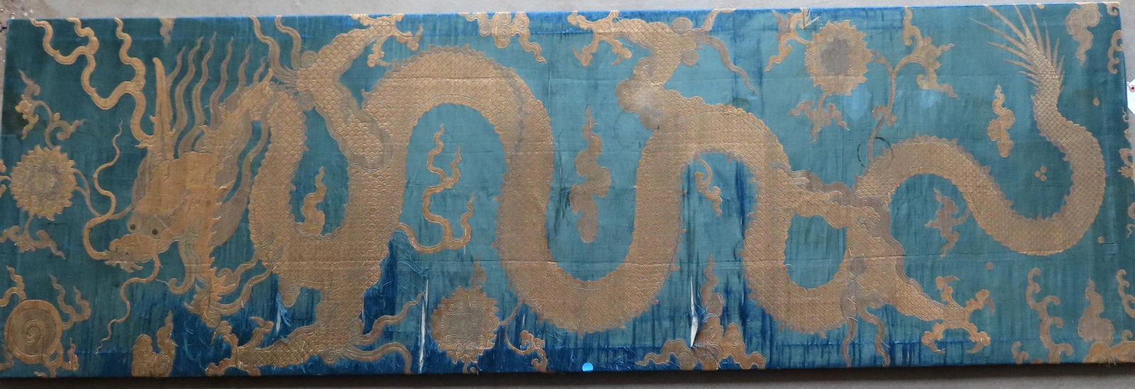 A large Chinese silk embroidery depicting a dragon in (1 of 10)