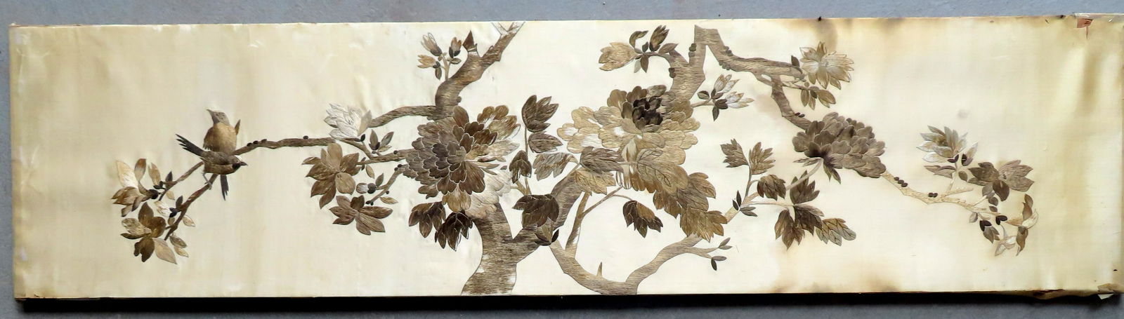 An oriental silk embroidery depicting a flowering tree (1 of 7)