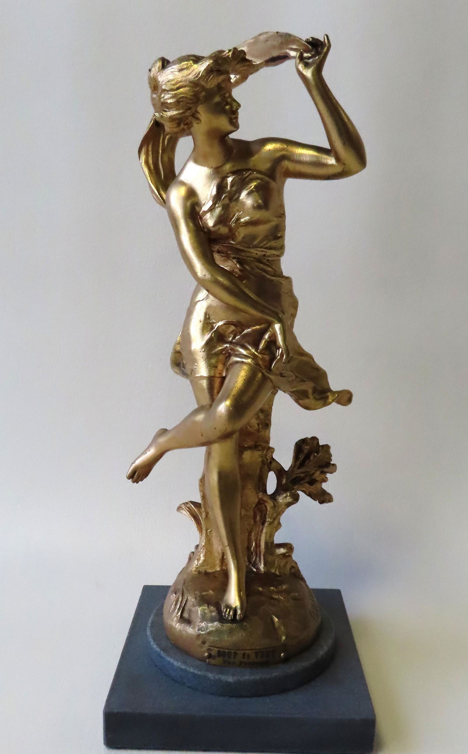 A gilded metal sculpture of a dancing lady, mounted on (1 of 5)