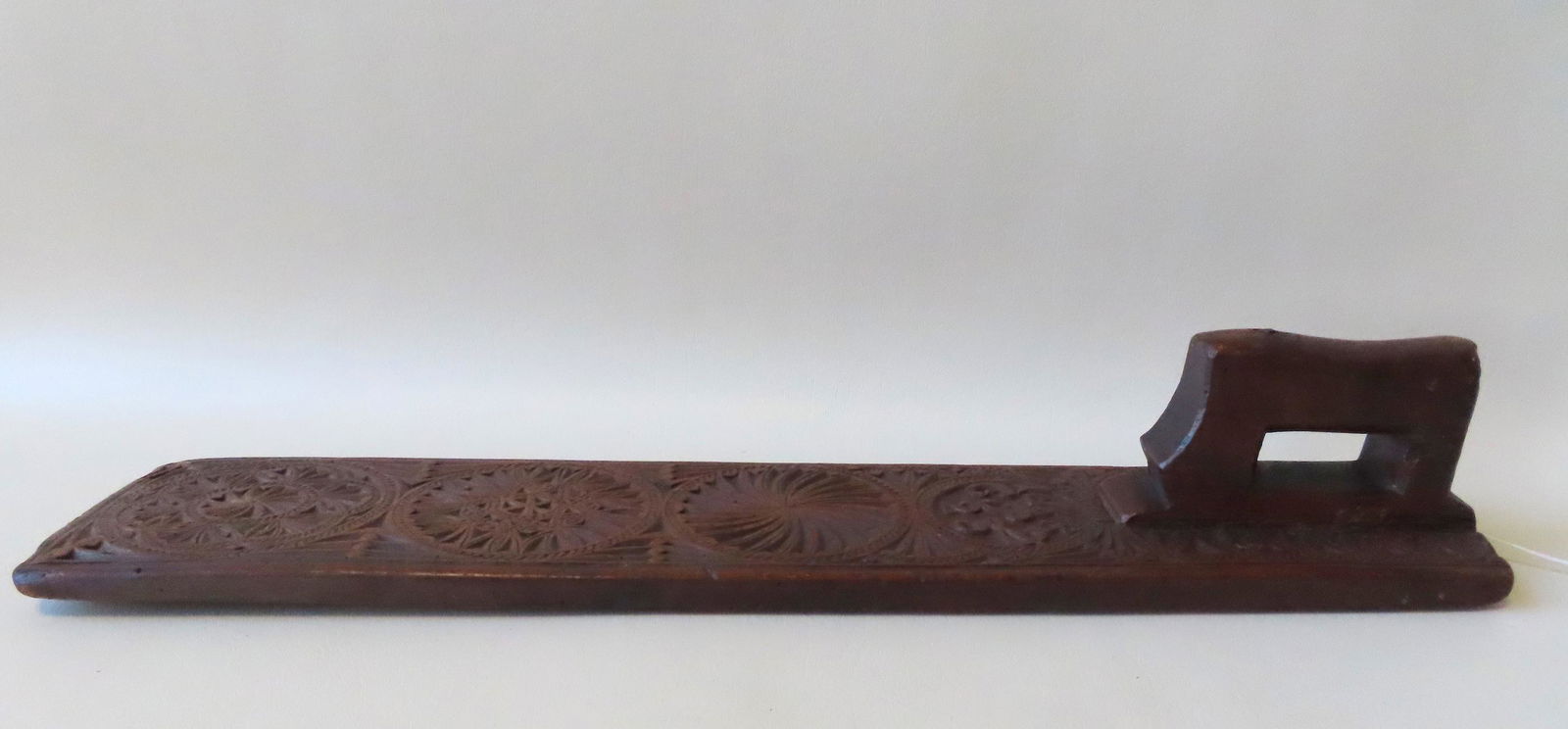 An early hand carved mangle board with extensive (1 of 8)