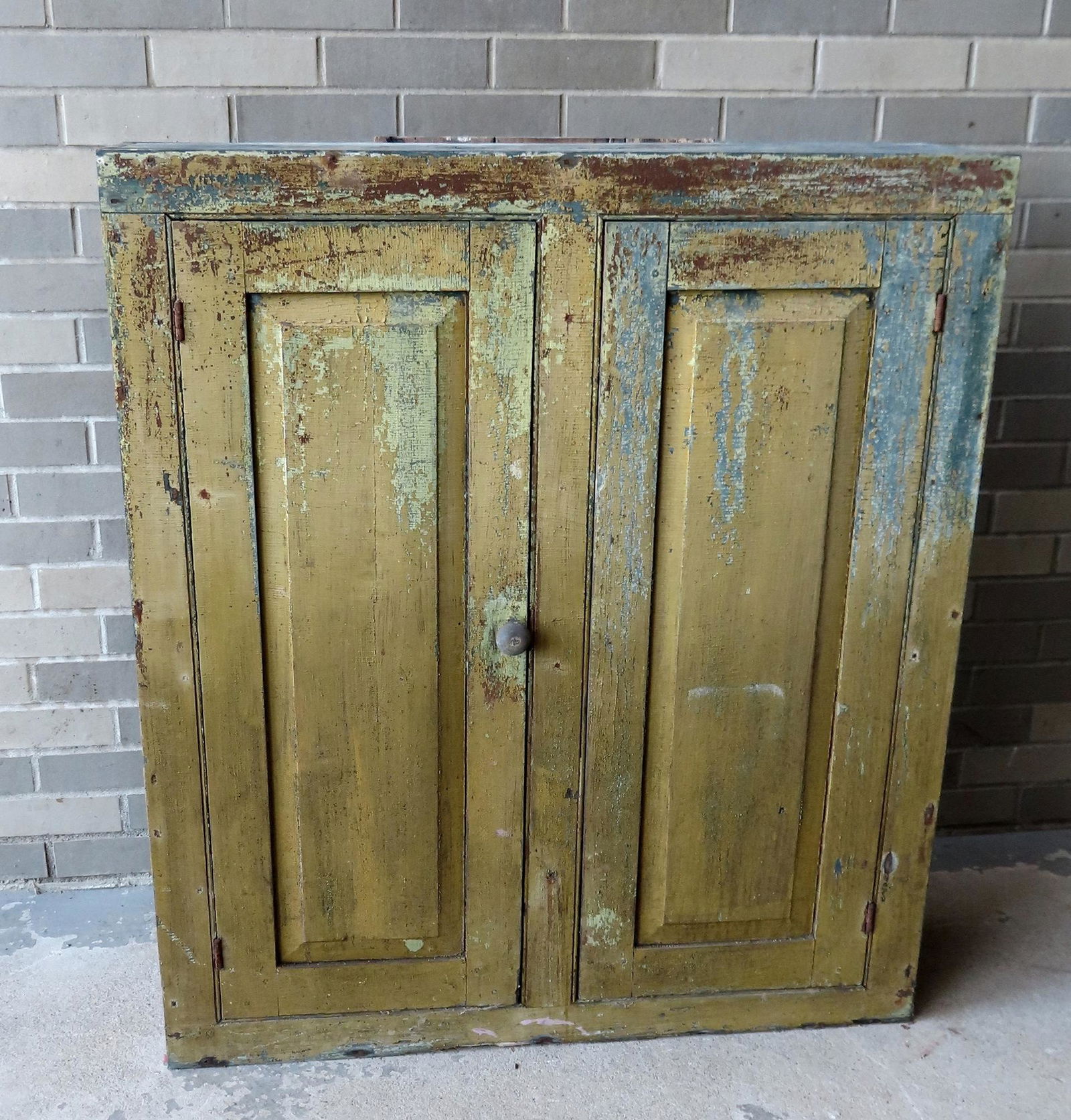 Early 2 door floor cupboard having 2 raised panel doors (1 of 7)