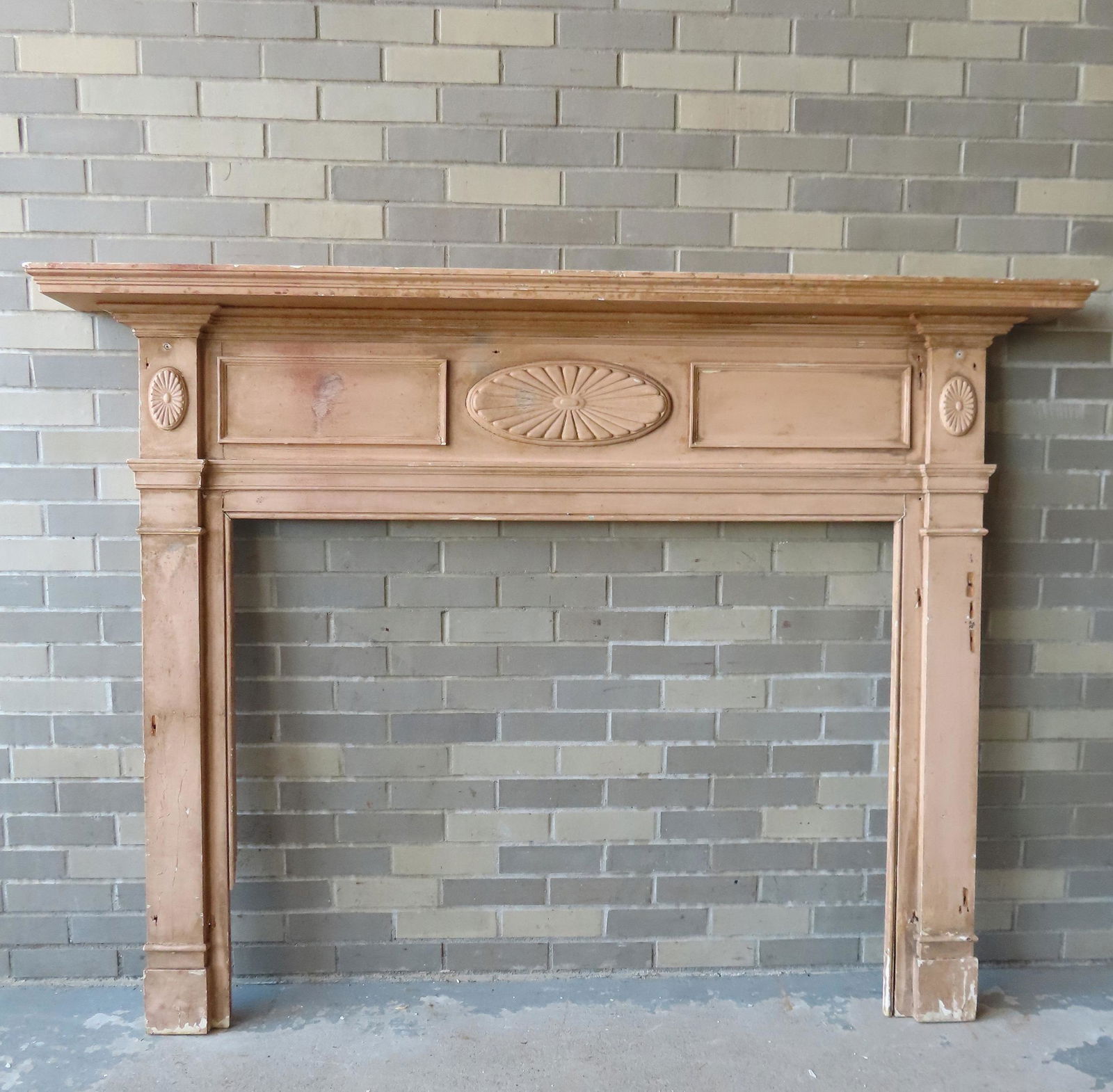 A custom made fireplace mantle having an architectural (1 of 8)