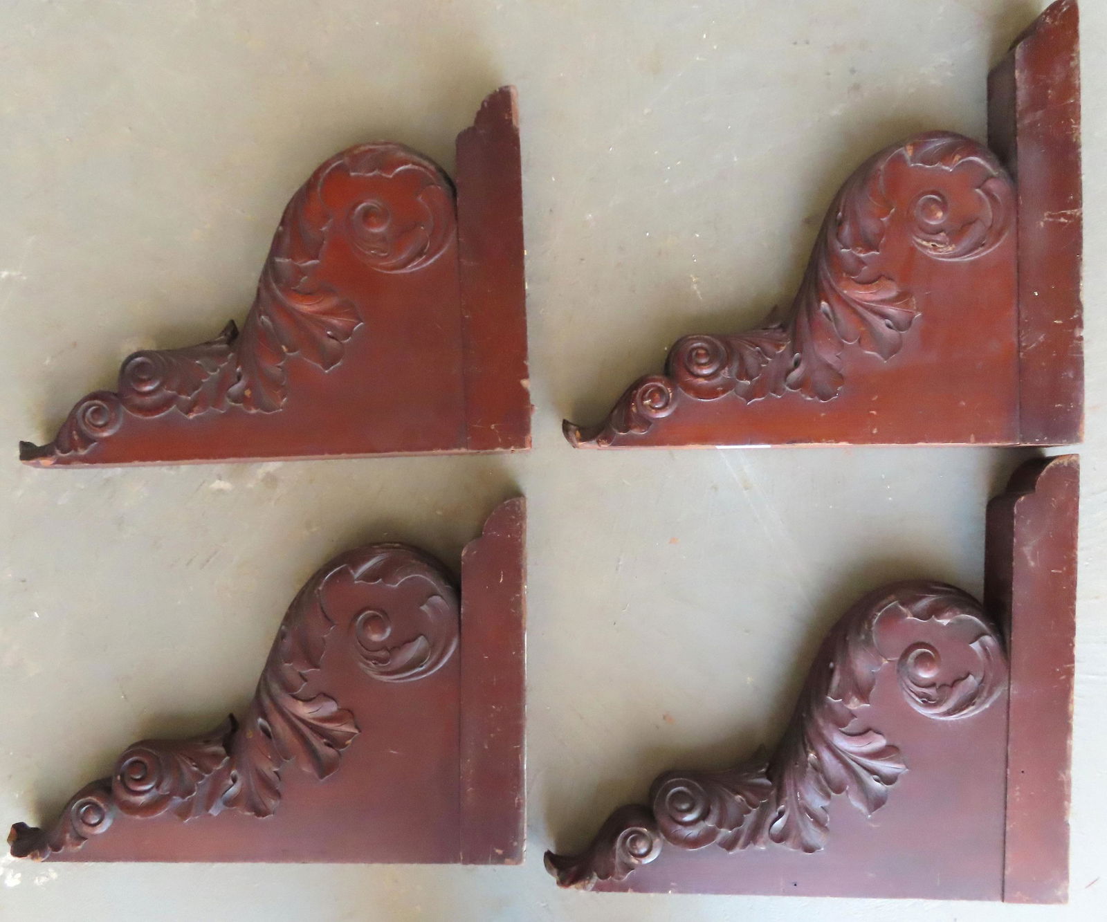 A grouping of 4 identical carved wooden acanthus (1 of 8)