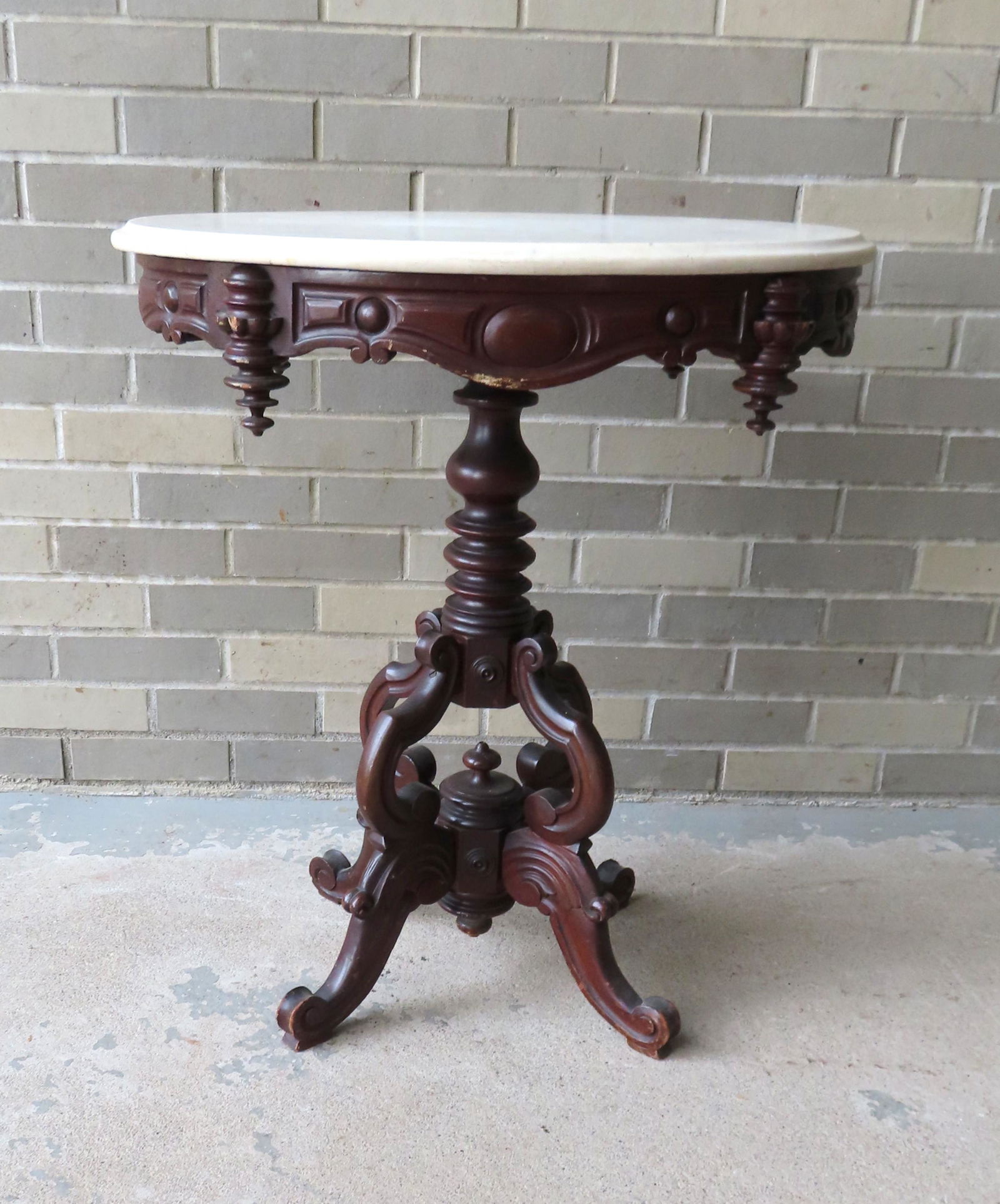 A Victorian black walnut oval marble top lamp table. (1 of 7)