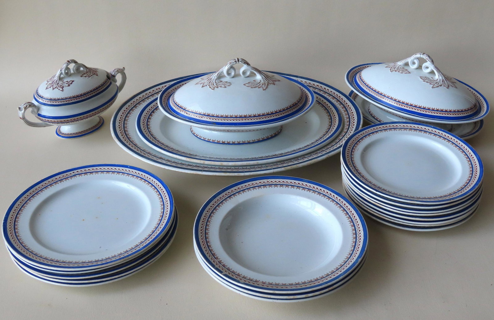 A partial set of Ashworth British earthenware china: A partial set of Ashworth British earthenware china with decorated rims, 19th century, consisting of the following: 8 plates 9 1/2" diameter - 2 with tiny flakes on edge; 5 plates 10 3/8" diameter - a