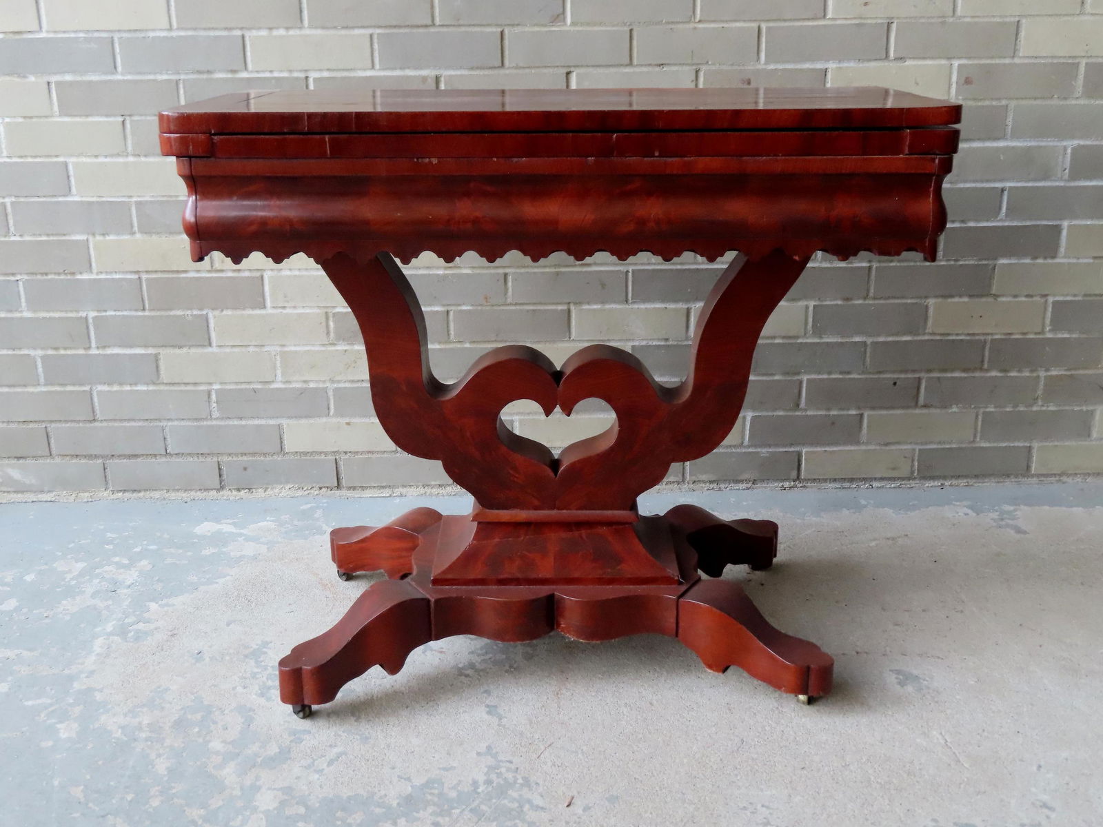 A mahogany game table with shaped apron, open work (1 of 6)