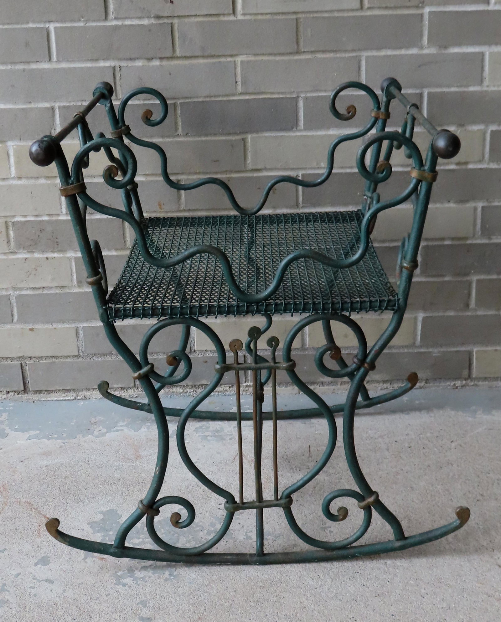 An unusual wrought iron rocking platform, possible a: An unusual wrought iron rocking platform, possible a cradle with wire mesh seat that likely held a cushion or mattress - late 19th to early 20th century. Very good condition. 22 1/2"W x 20"D x 23 1/4"