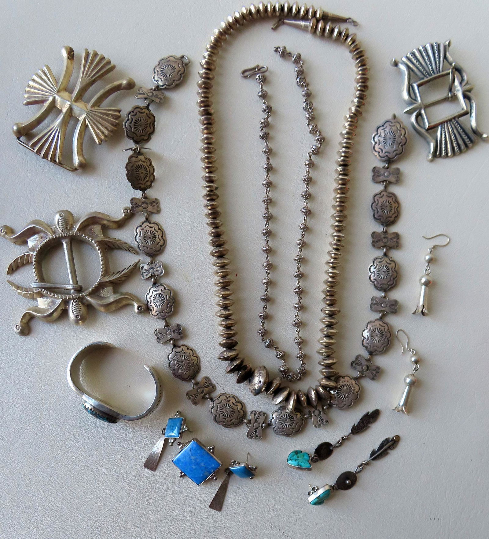 A grouping of Native American silver jewelry including: (1 of 8)