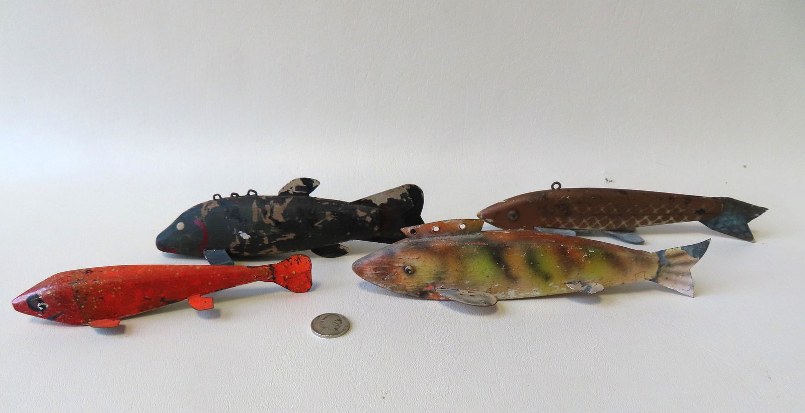 Grouping of 4 carved wooden ice fishing decoys in (1 of 17)