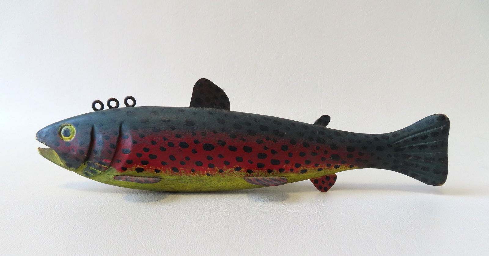 A large carved and painted ice fishing decoy in the (1 of 4)