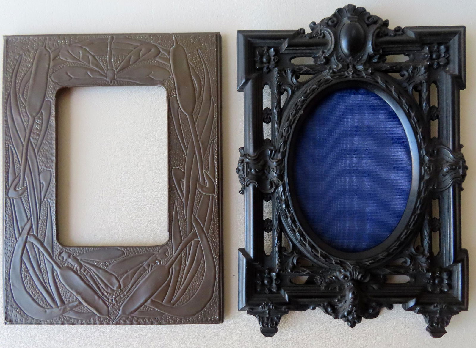 Two ornate frames. The first is black composition, (1 of 6)
