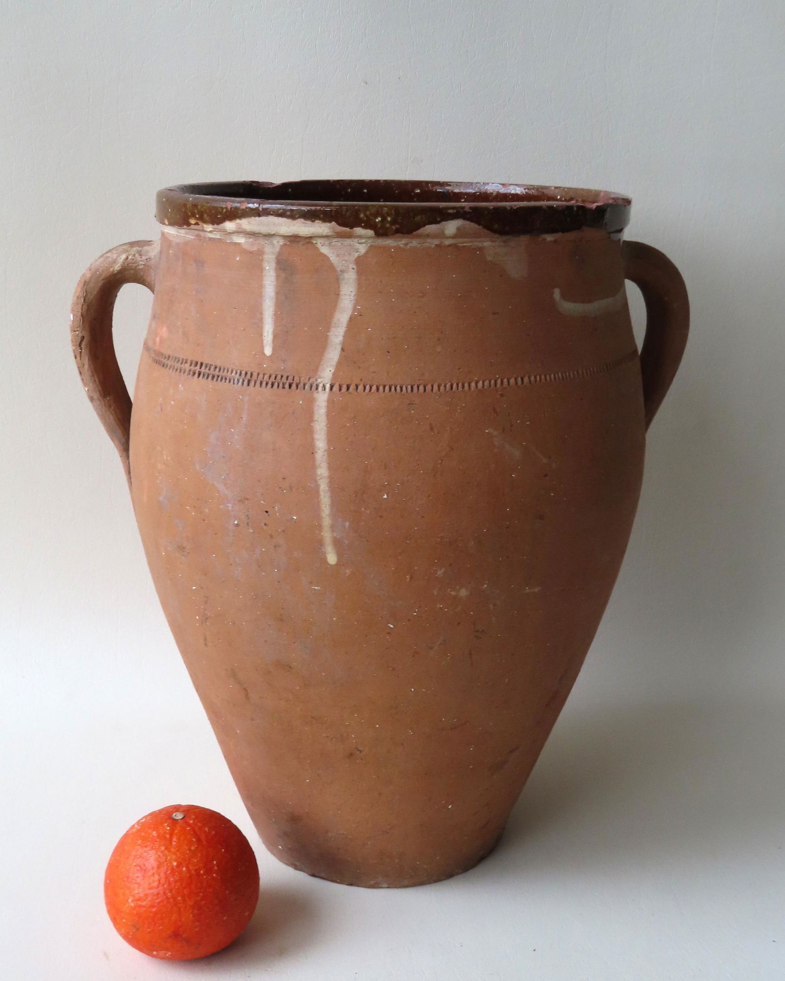 A large utilitarian redware jar with double handles and (1 of 6)