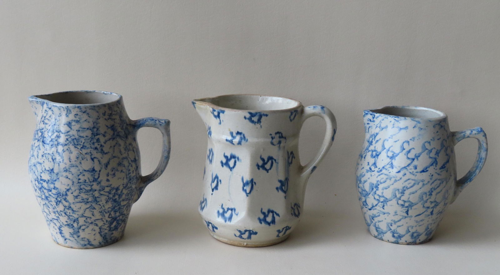 A grouping of 3 blue and white spongeware pitchers, all (1 of 5)