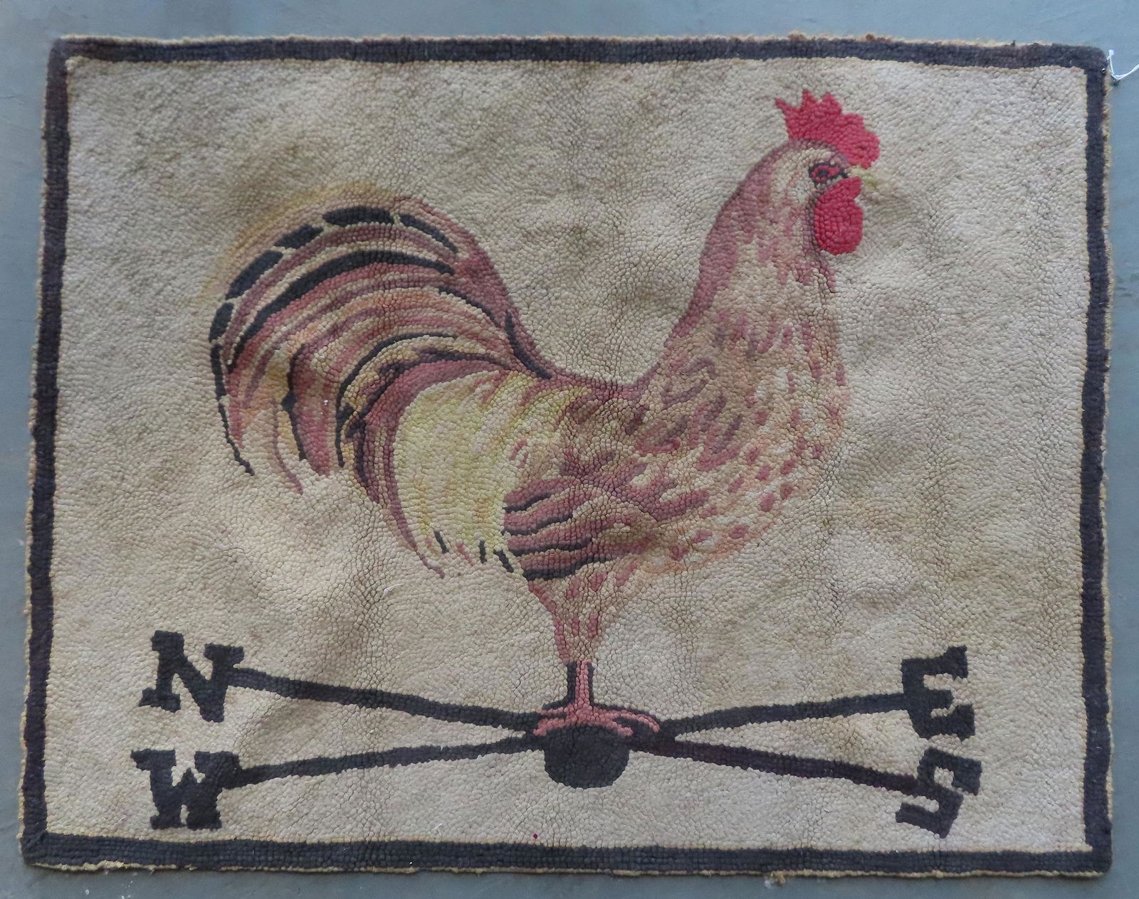 Hooked rug of a rooster weathervane with directionals, (1 of 3)