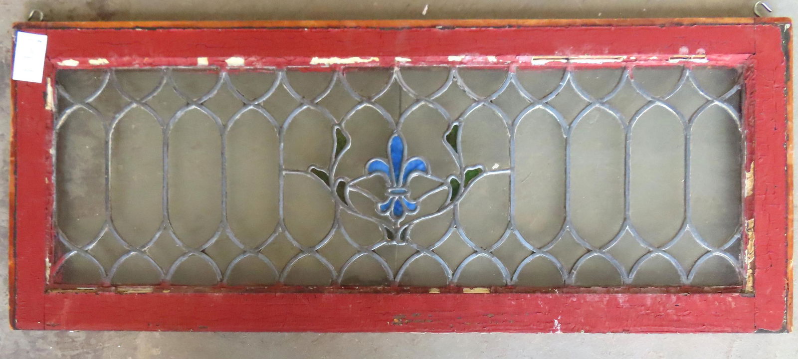 A leaded and stained glass window with fleur-de-lis (1 of 3)