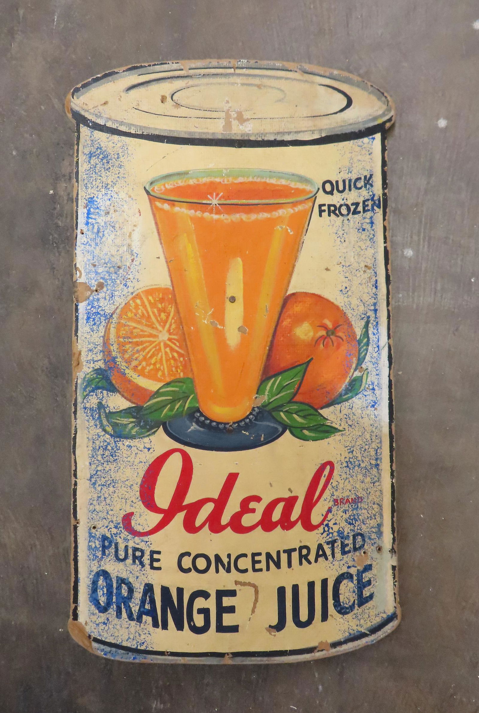 A composition advertising sign in the shape of a tin (1 of 3)