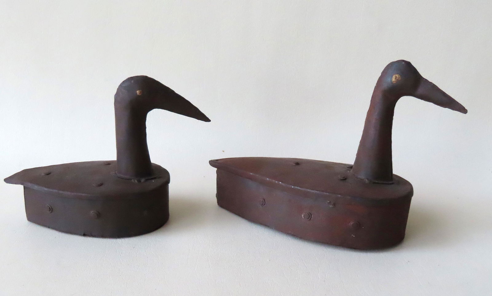 Two mid-century hand made tin duck decoys with faux (1 of 7)