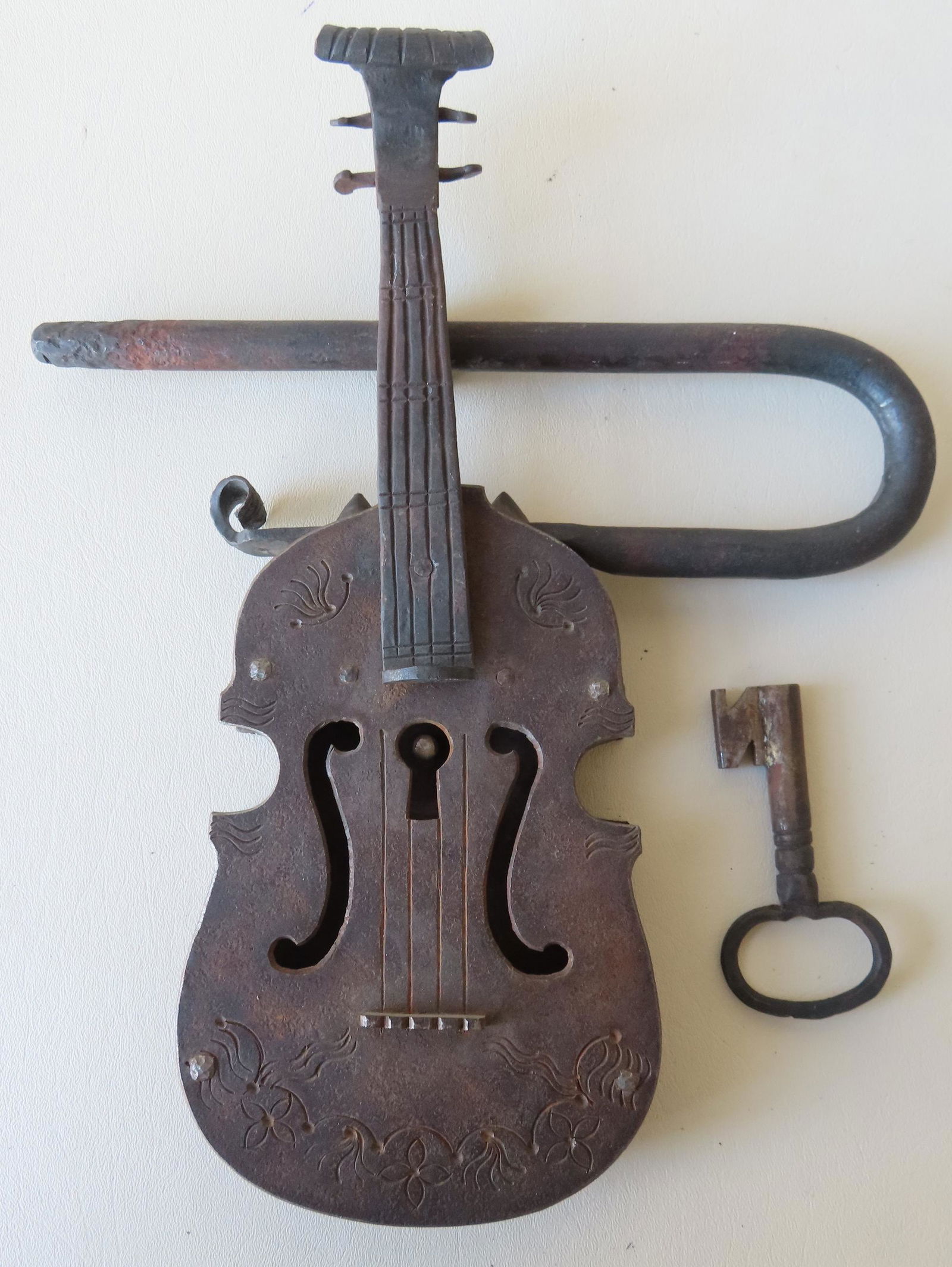 An unusual hand made cast iron lock in the form of a (1 of 3)