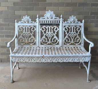 A cast iron gothic garden bench signed "John McLean / Maker N.Y." - the crest of bench with applied: A cast iron gothic garden bench signed "John McLean / Maker N.Y." - the crest of bench with applied label "Jacob Abeles"-late 19th century. Very good condition. 46"W x 18"D x 38 1/2"H. Provenance: