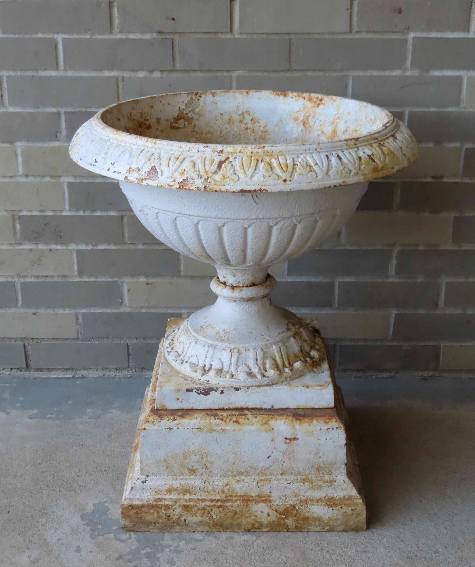Cast iron garden urn with stepped plinth, 19th century. Measures 24 1/2"H x 21" diameter. Very good (1 of 4)