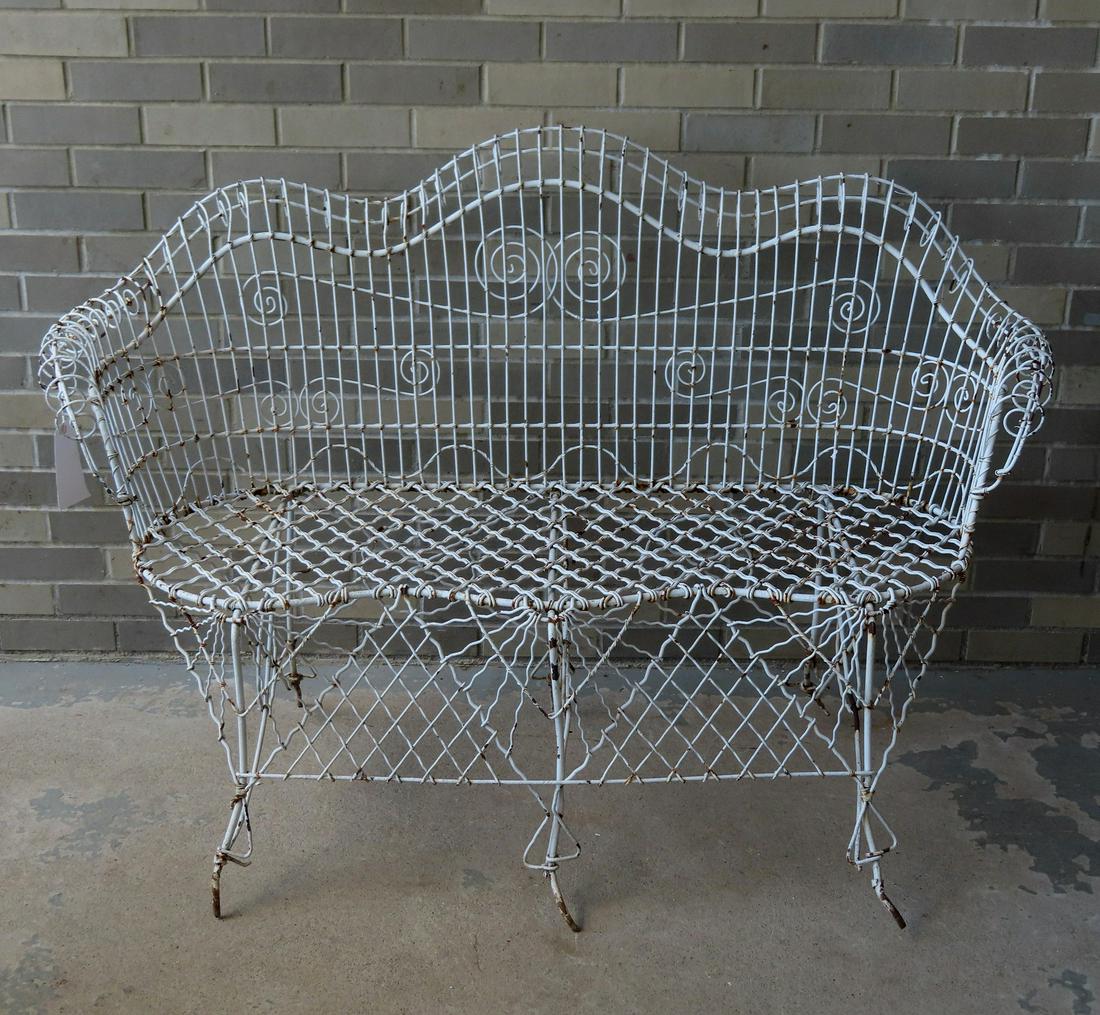 A Victorian wire garden settee. May have had pad feet which are missing and 2 wire stretchers (1 of 5)