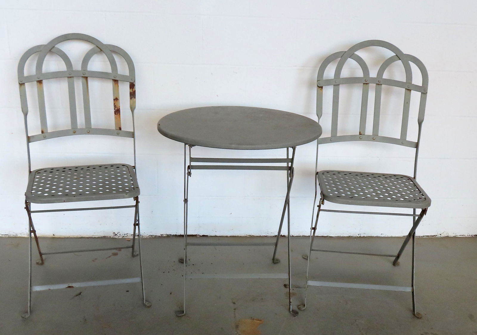 A good French cafÃ© iron patio set consisting of a small round folding table and 2 matching folding (1 of 6)