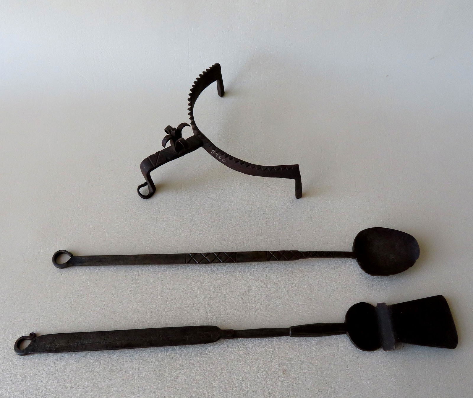 Three early hand forged iron utensils including an unusual 1/2 round plate/pot lifter with decorated (1 of 8)