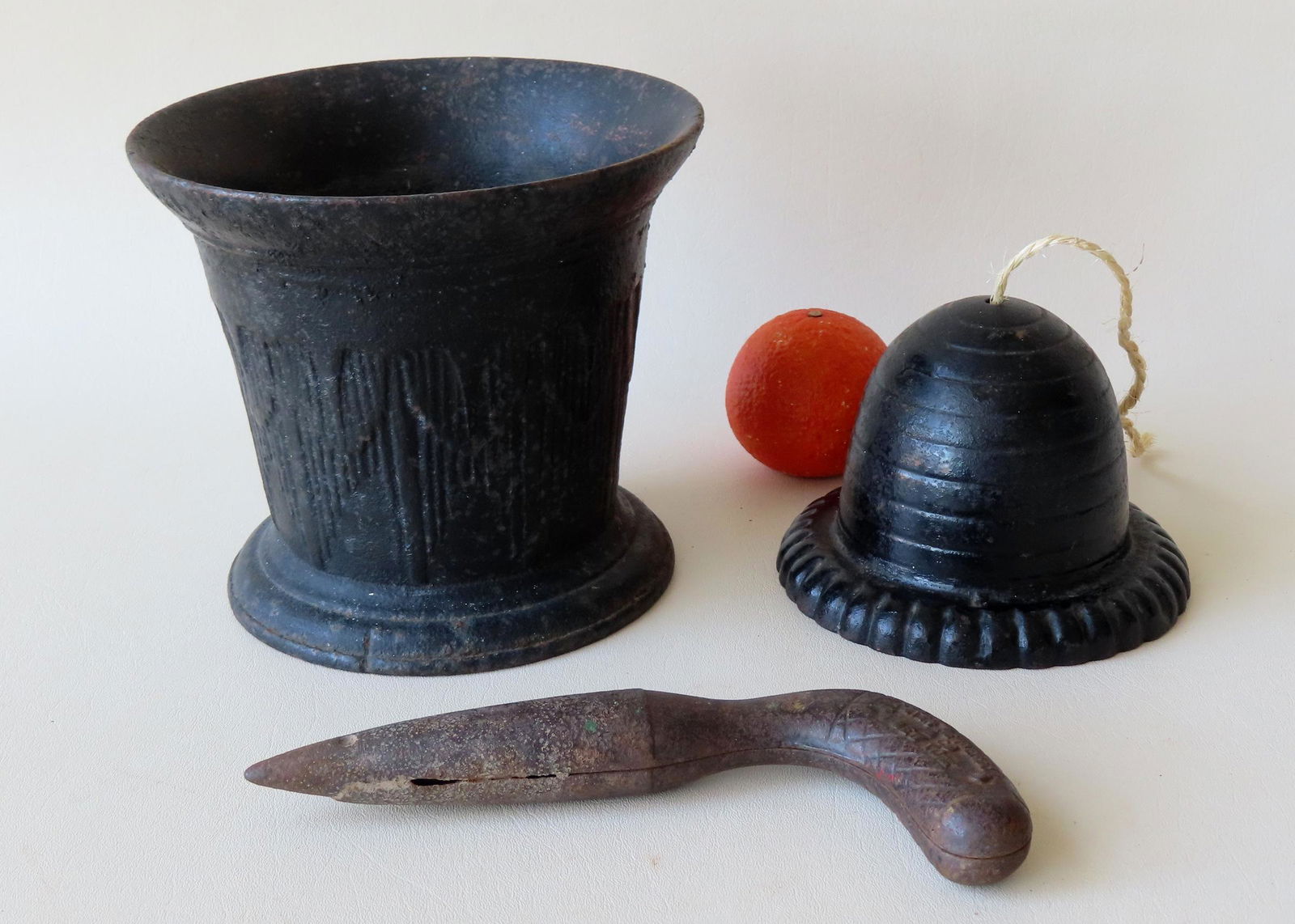 Three early cast iron objects including: Beehive string holder - 6 1/4" diameter x 4 1/4"H; a large (1 of 5)