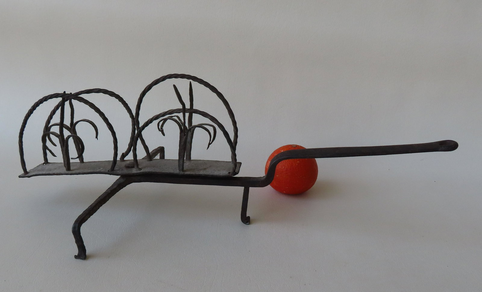 A fancy hand forged iron revolving toaster, late 18th century. Good condition. Measures 16 1/4"L x (1 of 4)