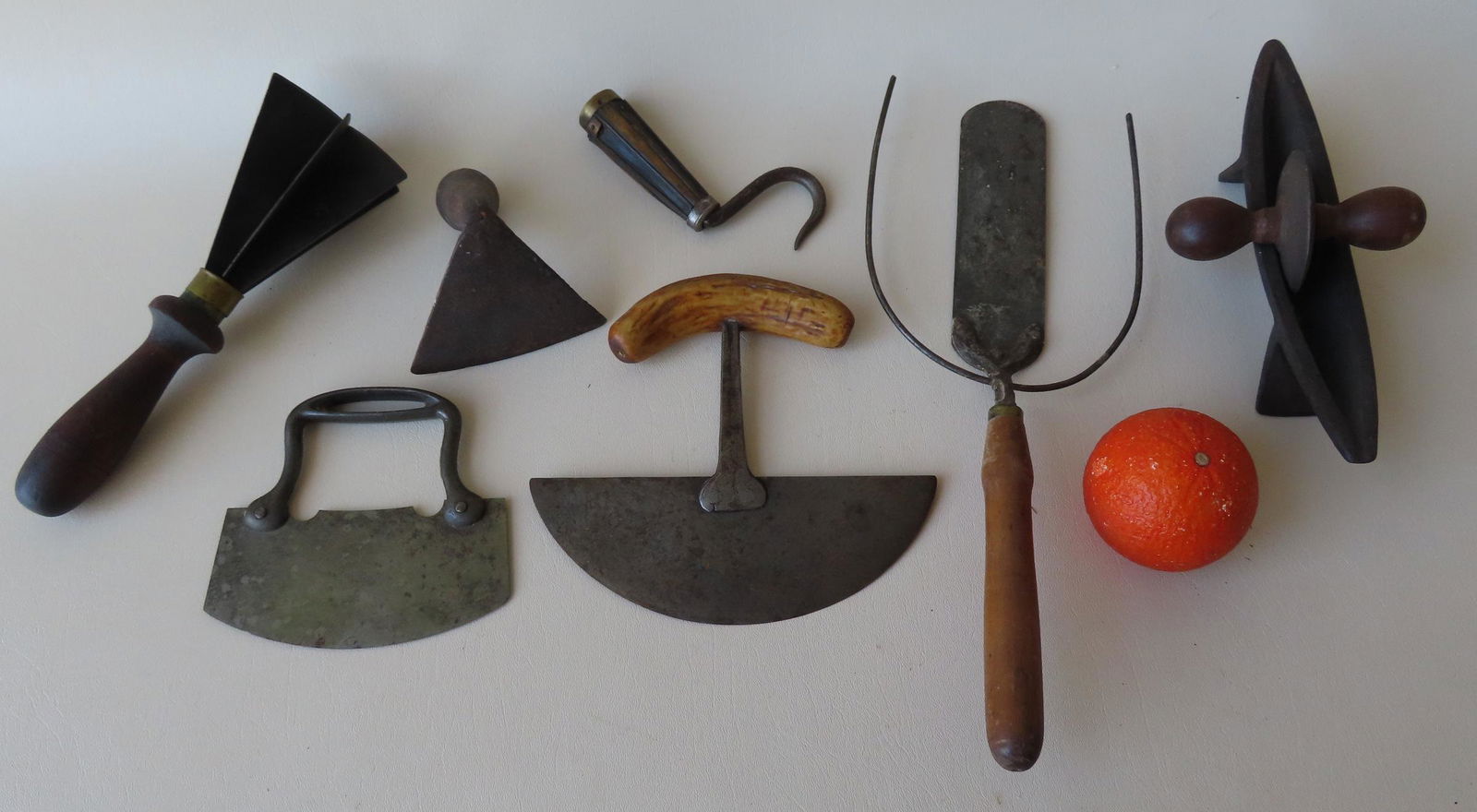 A grouping of 8 early utensils including: 3 food choppers, one hand forged with animal horn handle; (1 of 8)