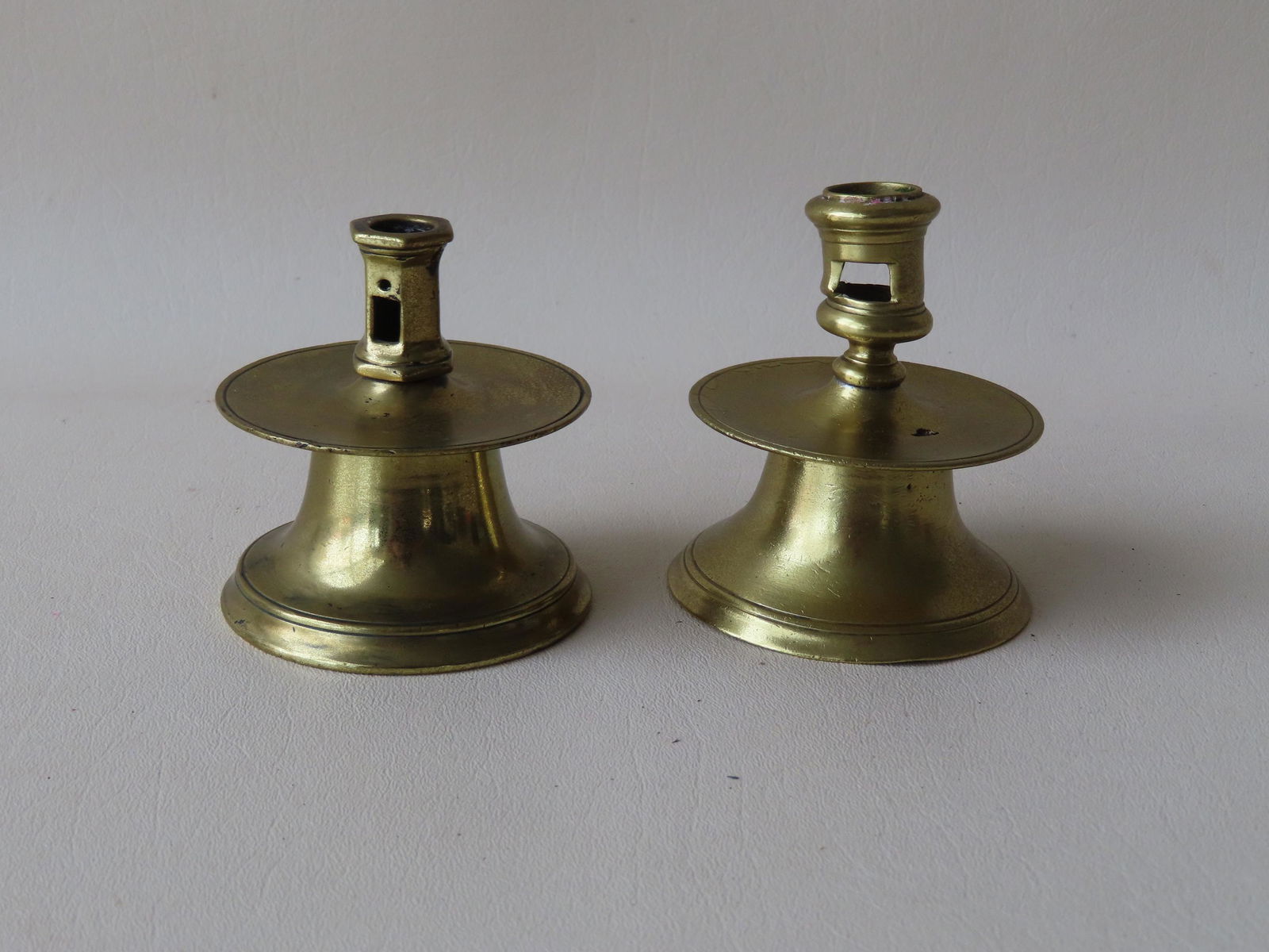 Pair near matching small brass candlesticks with extracting holes, circular drip pans and capstan (1 of 10)