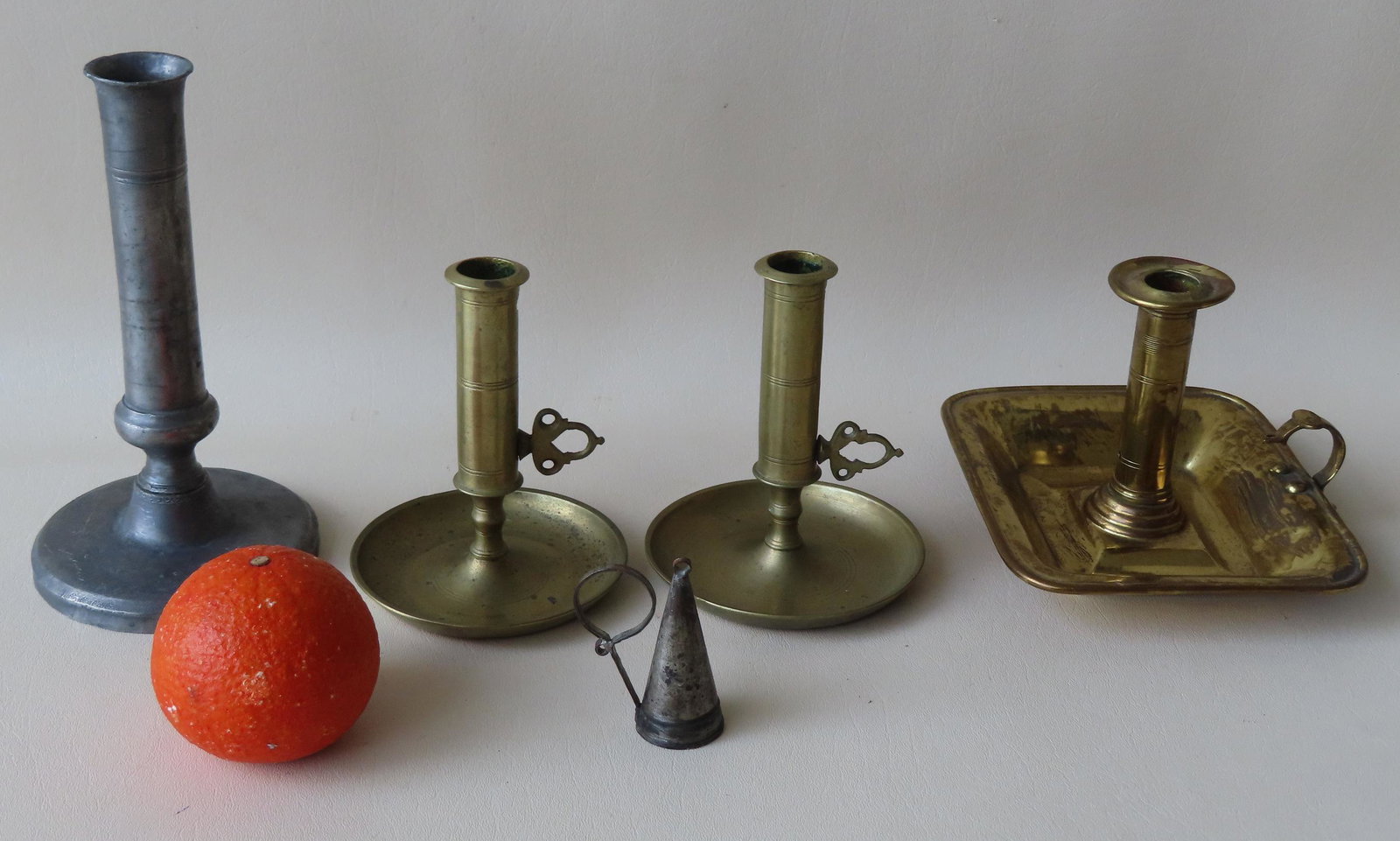 Grouping of 5 candle lighting devices including: Two matching pushups in brass with pierced handles (1 of 10)