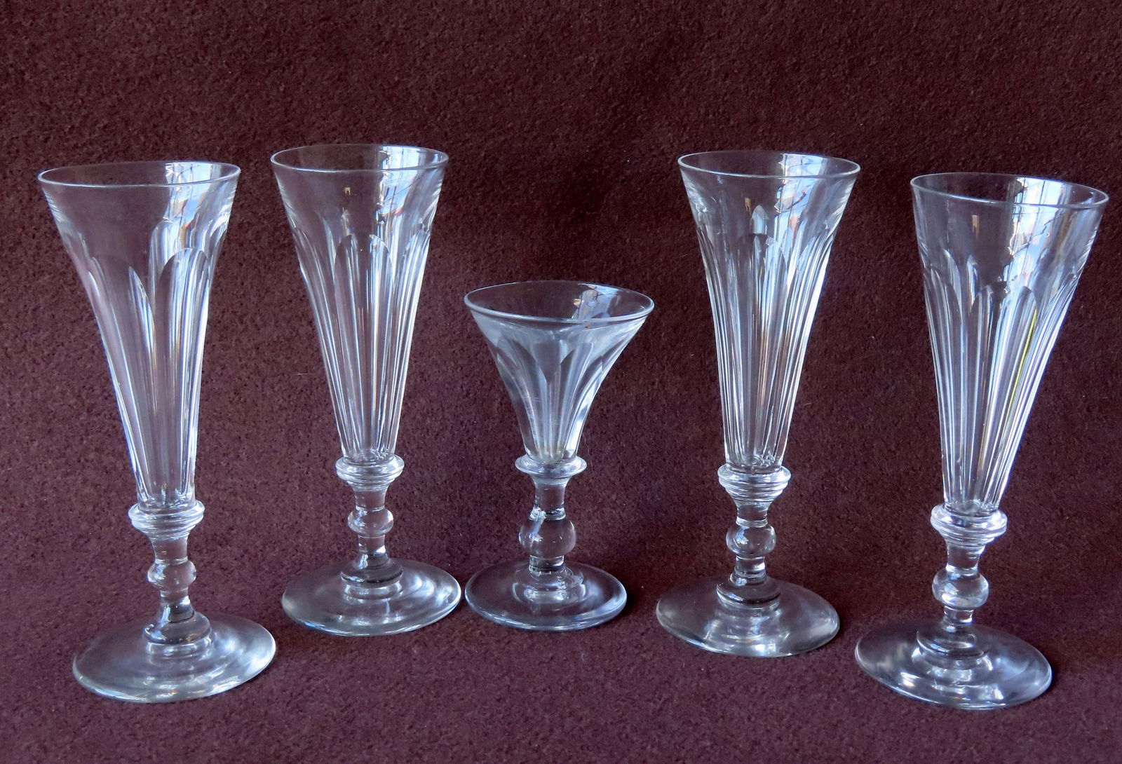 Five cut flint glass wine glasses with polished bases. Includes 4 matching 6 3/8"H x 2 1/2" diameter: Five cut flint glass wine glasses with polished bases. Includes 4 matching 6 3/8"H x 2 1/2" diameter - all with double wafers separating the 2 sections. All in very good condition with no damage. Prov
