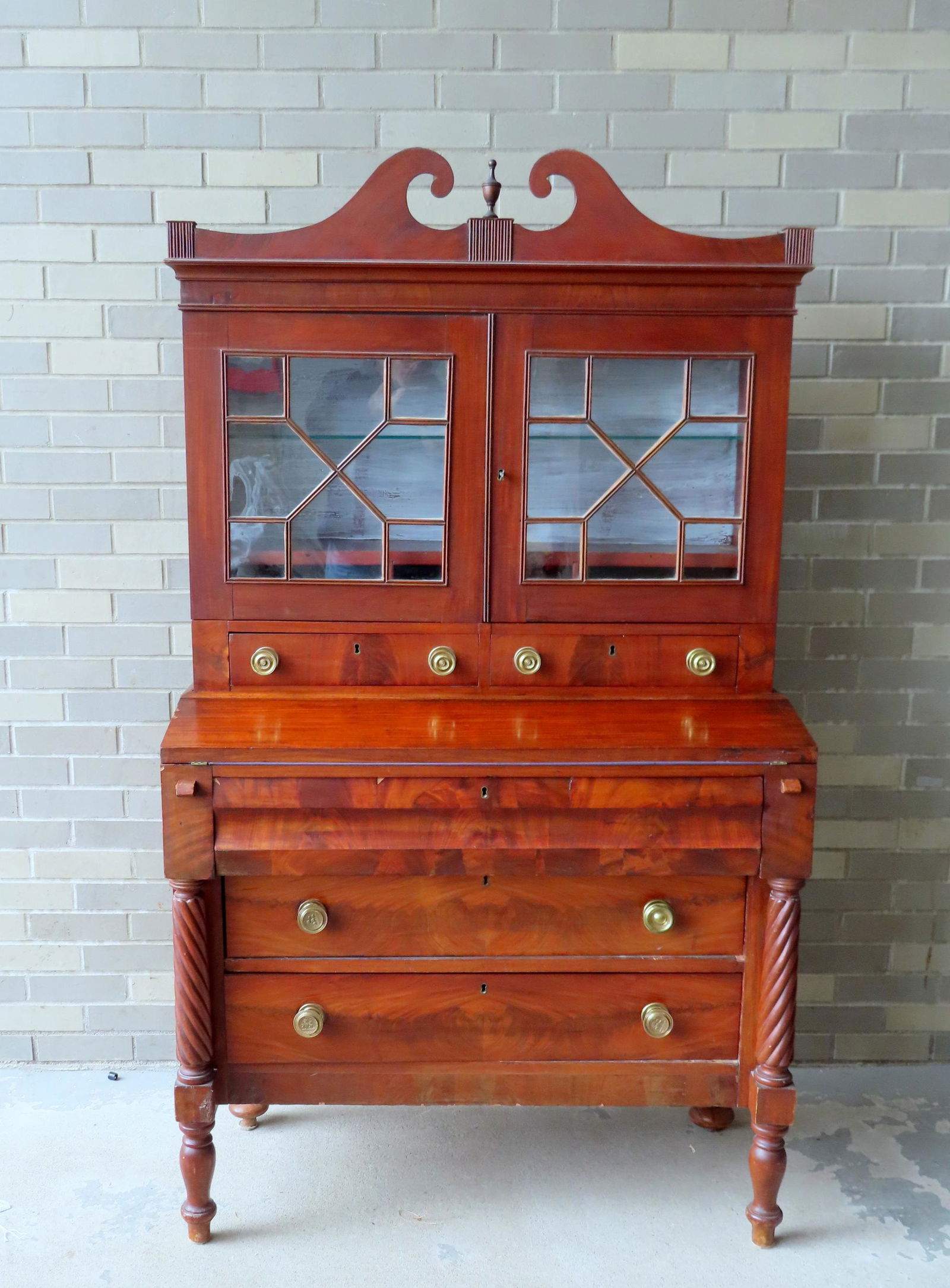 A good Sheraton mahogany secretary cabinet having a broken arch top, 2 glass doors over flip-top (1 of 10)