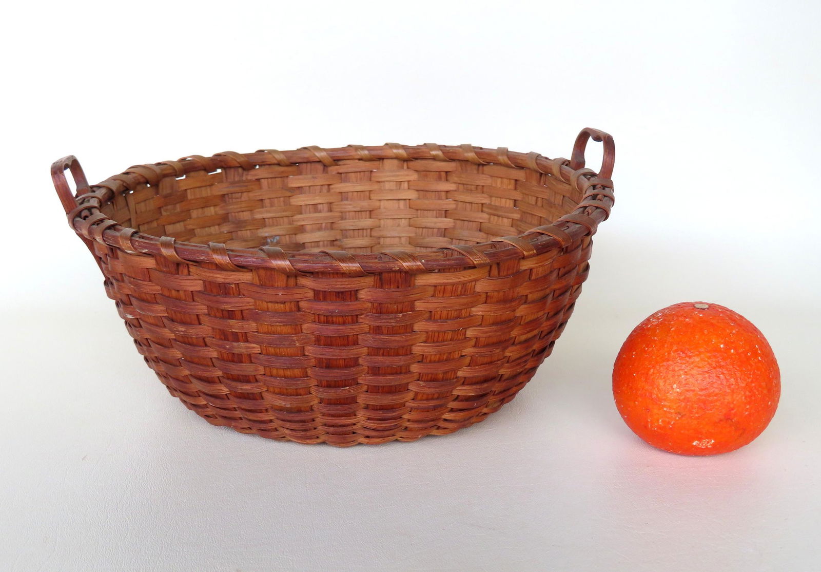 A very fine splint basket with double carved wooden handles having long tails - single wrapped rim. (1 of 5)