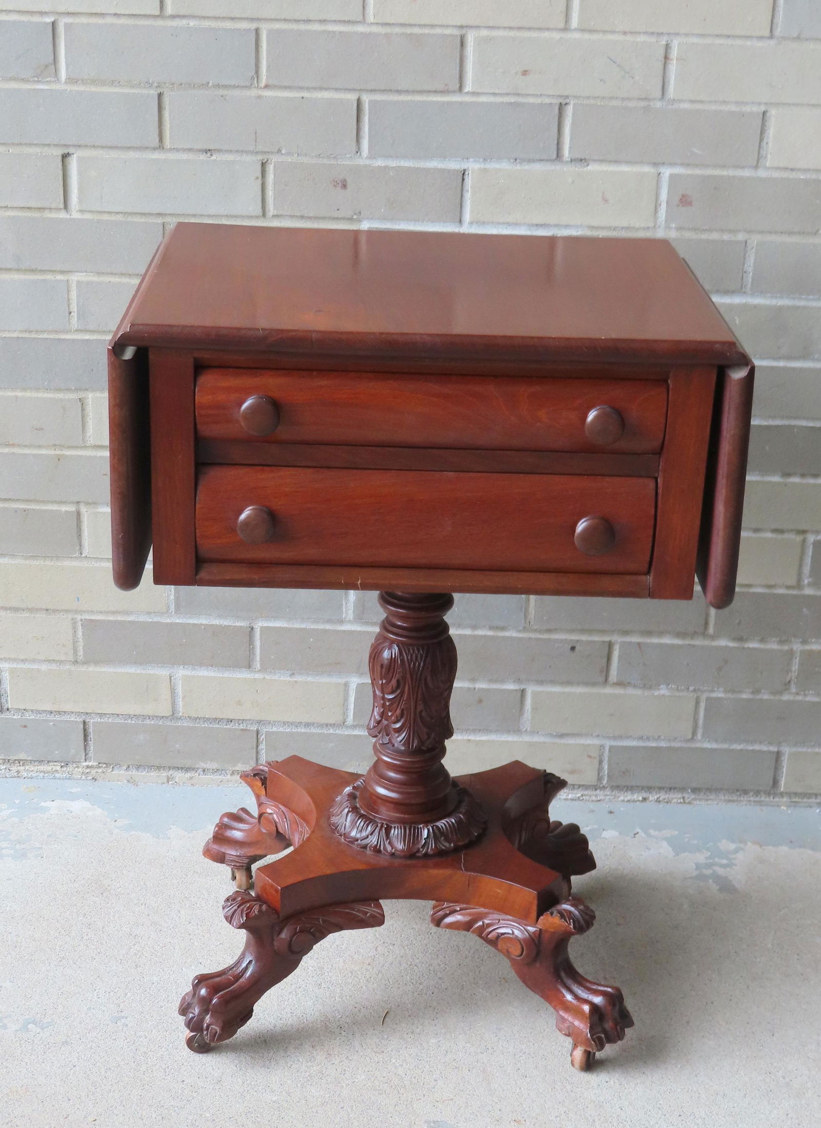 An Empire mahogany drop-leaf 2 drawer work table with acanthus carved column attached to shaped base (1 of 9)