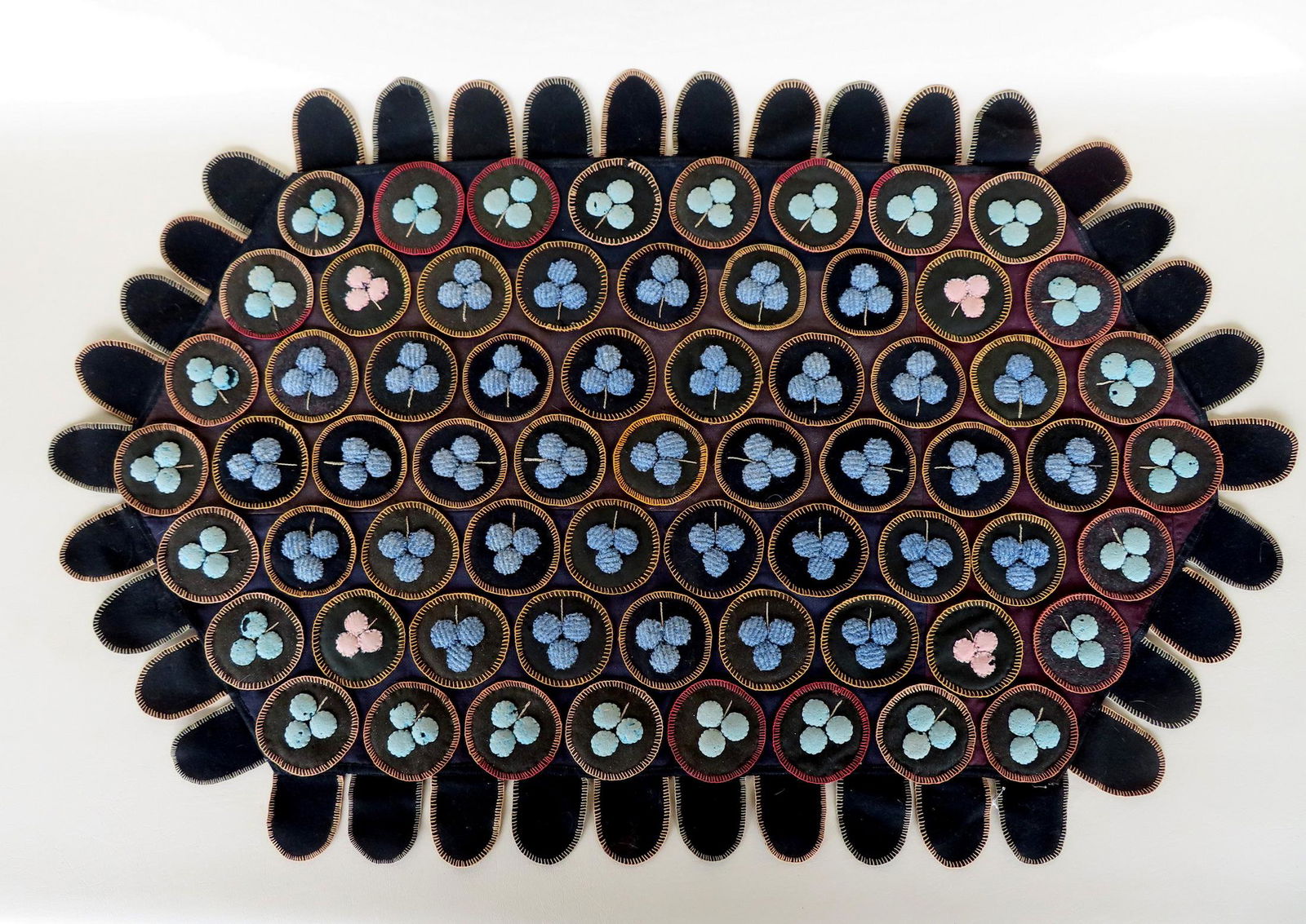 A table penny rug decorated with flowers, 19th century. Some of the puffed flowers with slight moth (1 of 7)