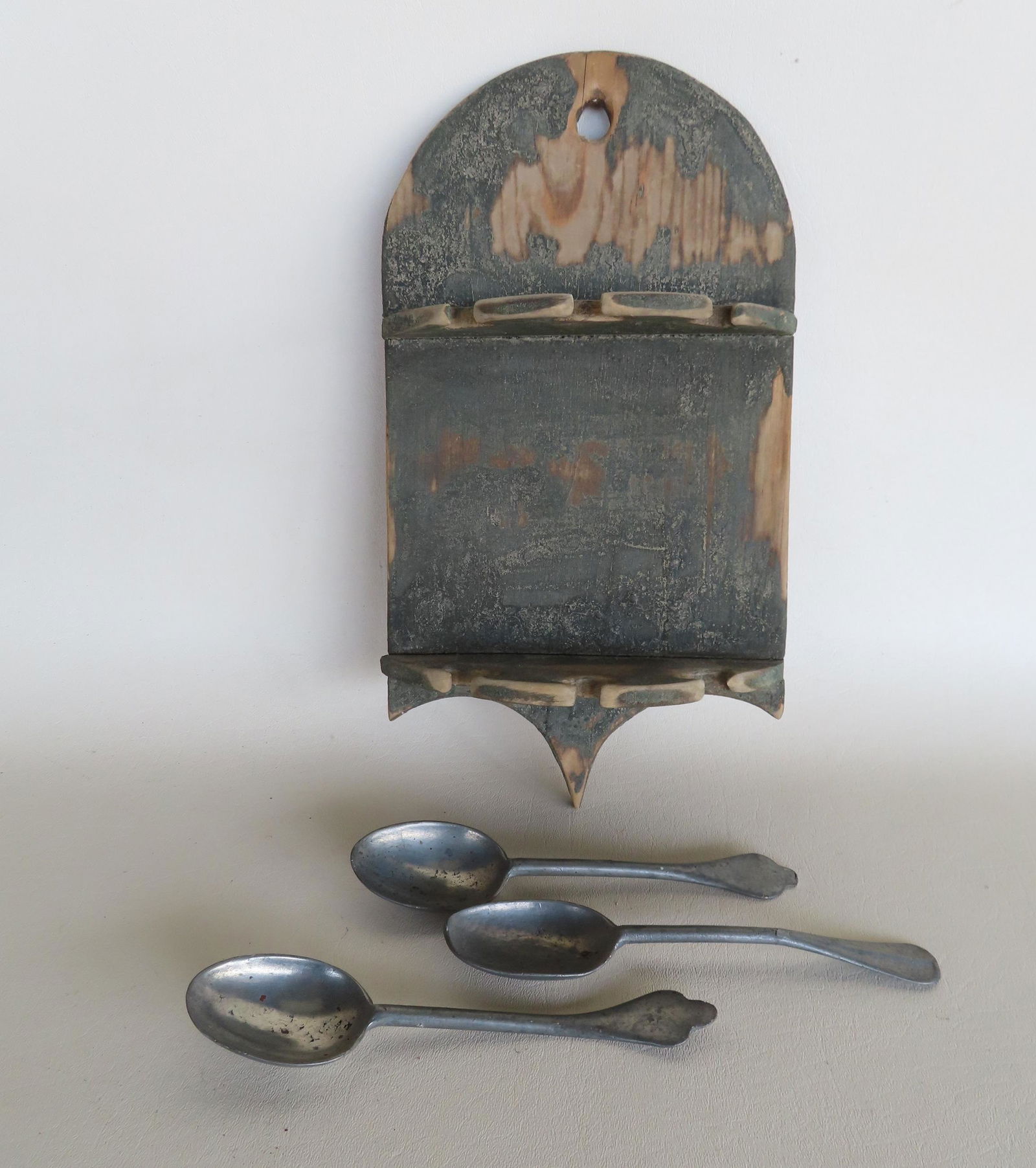 A spoon rack scraped down to original green paint (some areas appear to have been sanded). Unsure of (1 of 7)