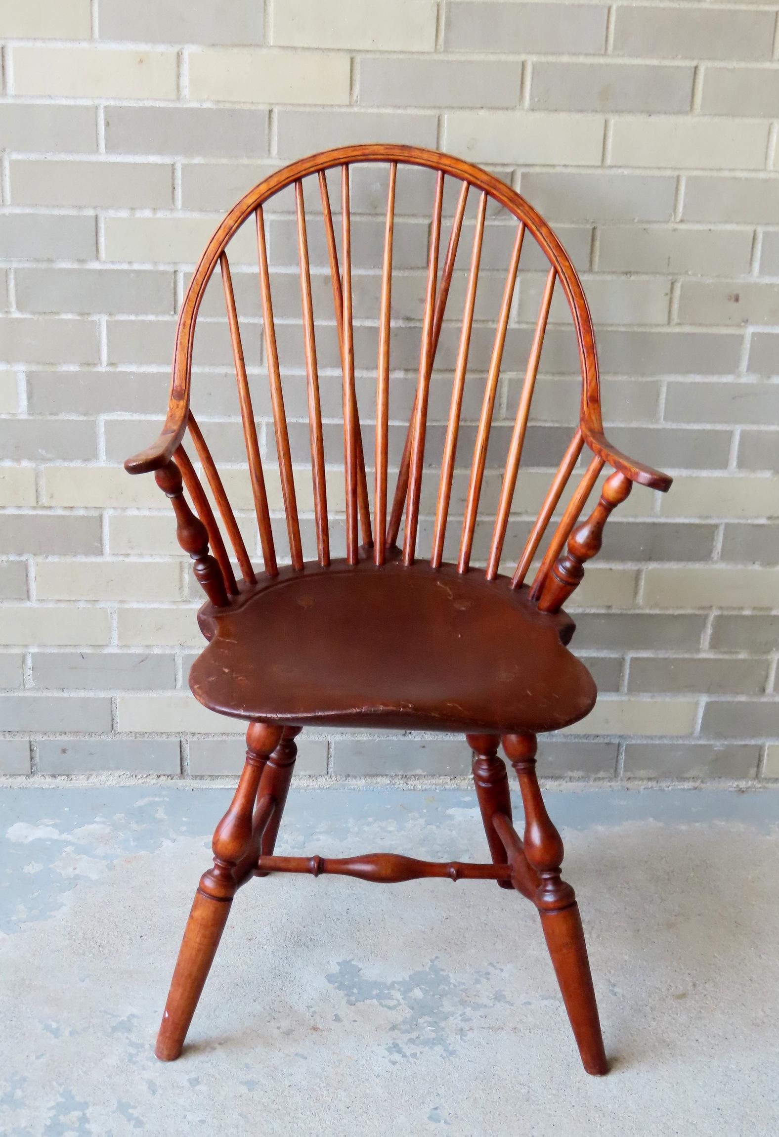 A brace back continuous arm Windsor chair with 13 spindles, saddle seat, splayed baluster form front (1 of 15)