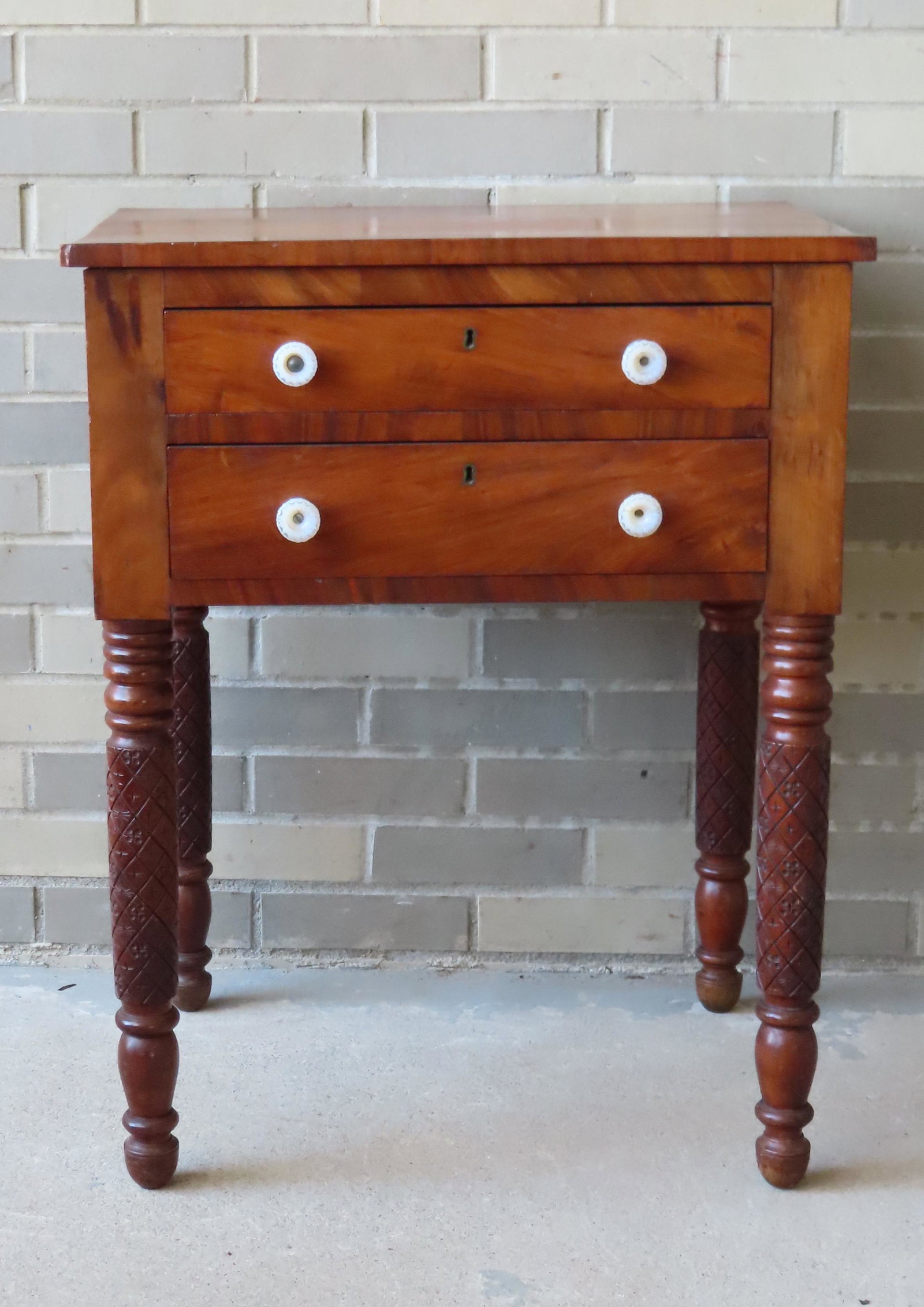 An Empire cherry and mahogany 2 drawer work table with carved and turned legs and having white (1 of 8)