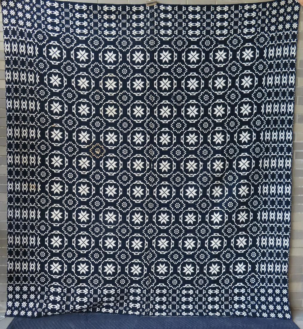 Blue and white homespun wool 2 part coverlet decorated with stars and having a stylized floral (1 of 5)