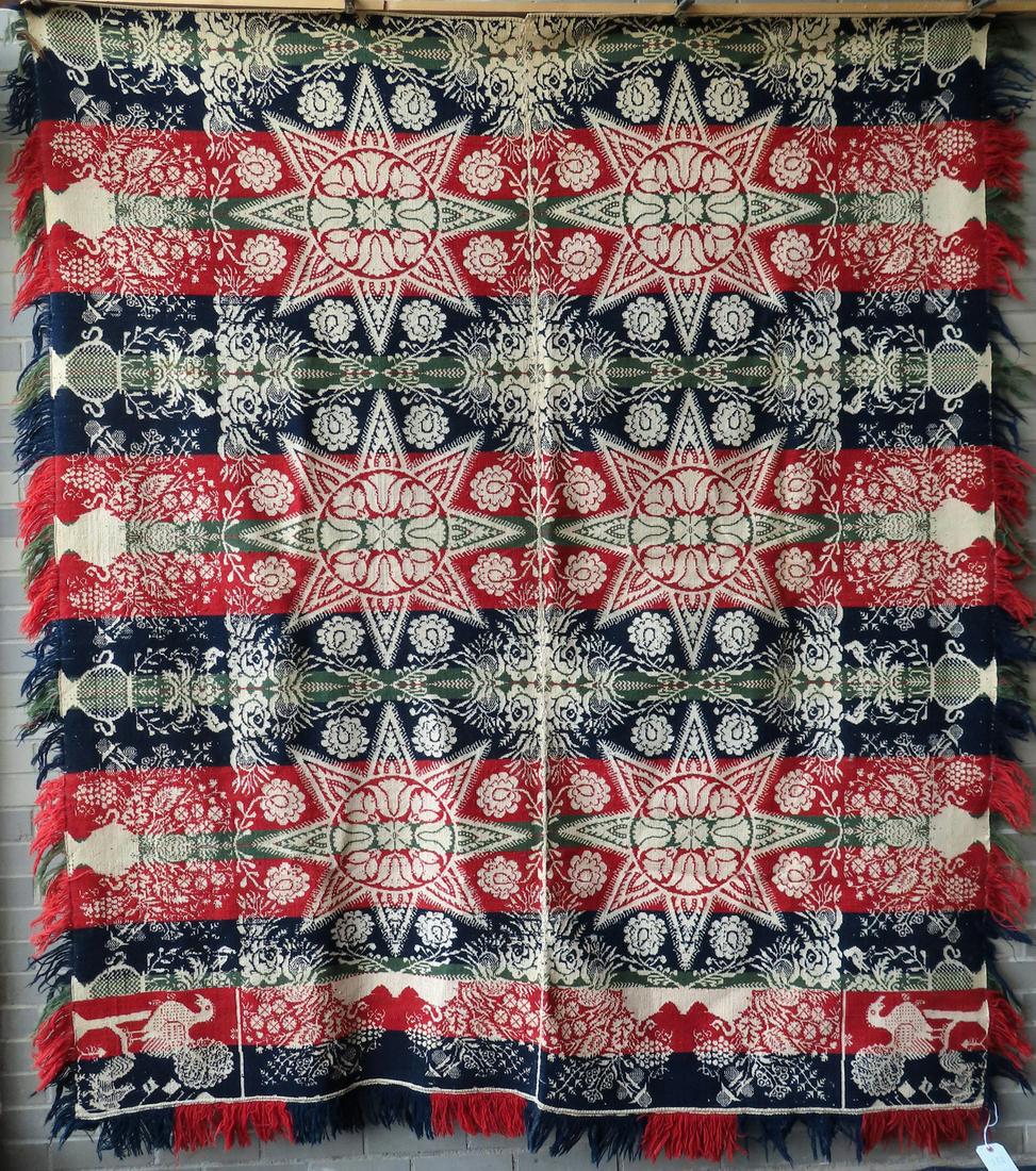 A  Jacquard tri-color coverlet in red, blue, and green on white ground, having a central image of 6 (1 of 10)