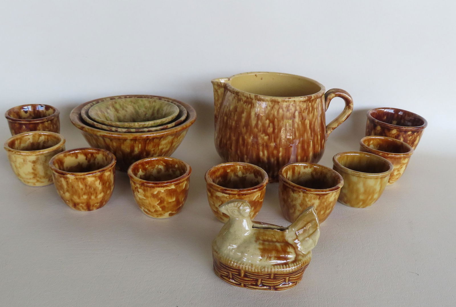 Grouping of 14 pieces of sponge decorated yellowware pottery including 3 nesting non-matching mixing (1 of 15)