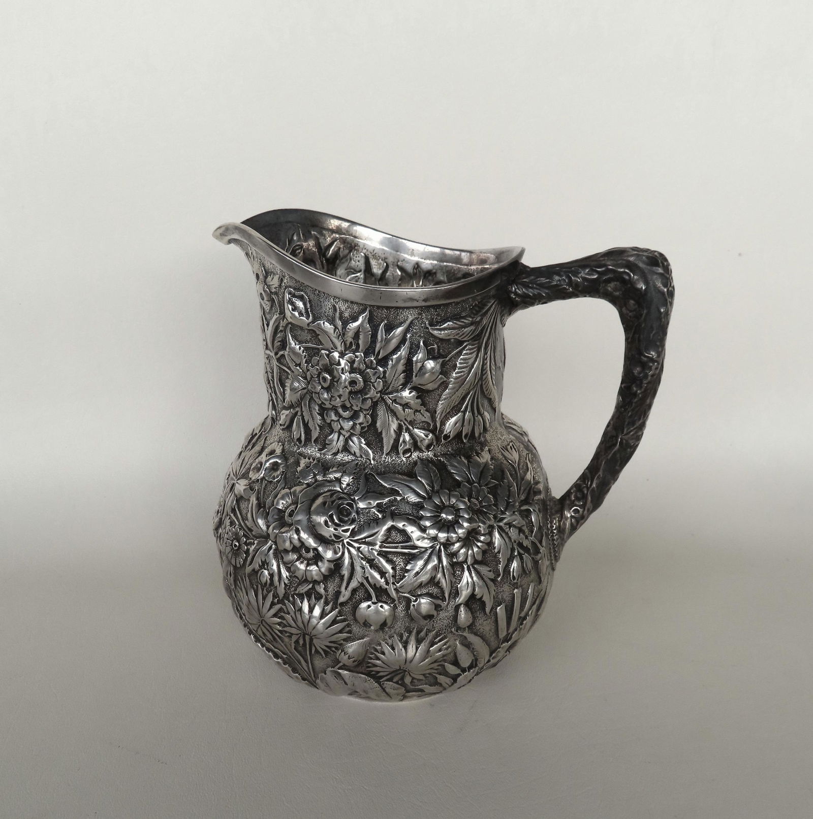 A very fine S. Kirk & Son #313 11 oz. sterling repousse pitcher - 7 3/4"H x 7"W -weighs 18.1 troy (1 of 6)